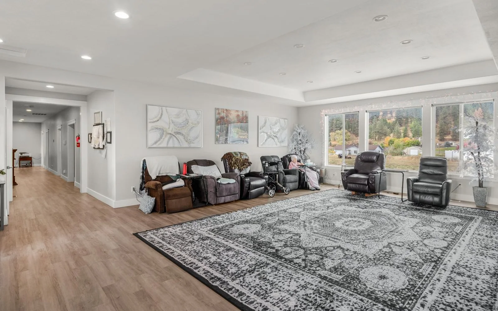 Bright common room and residential hallway at A+ Quality Adult Family Home